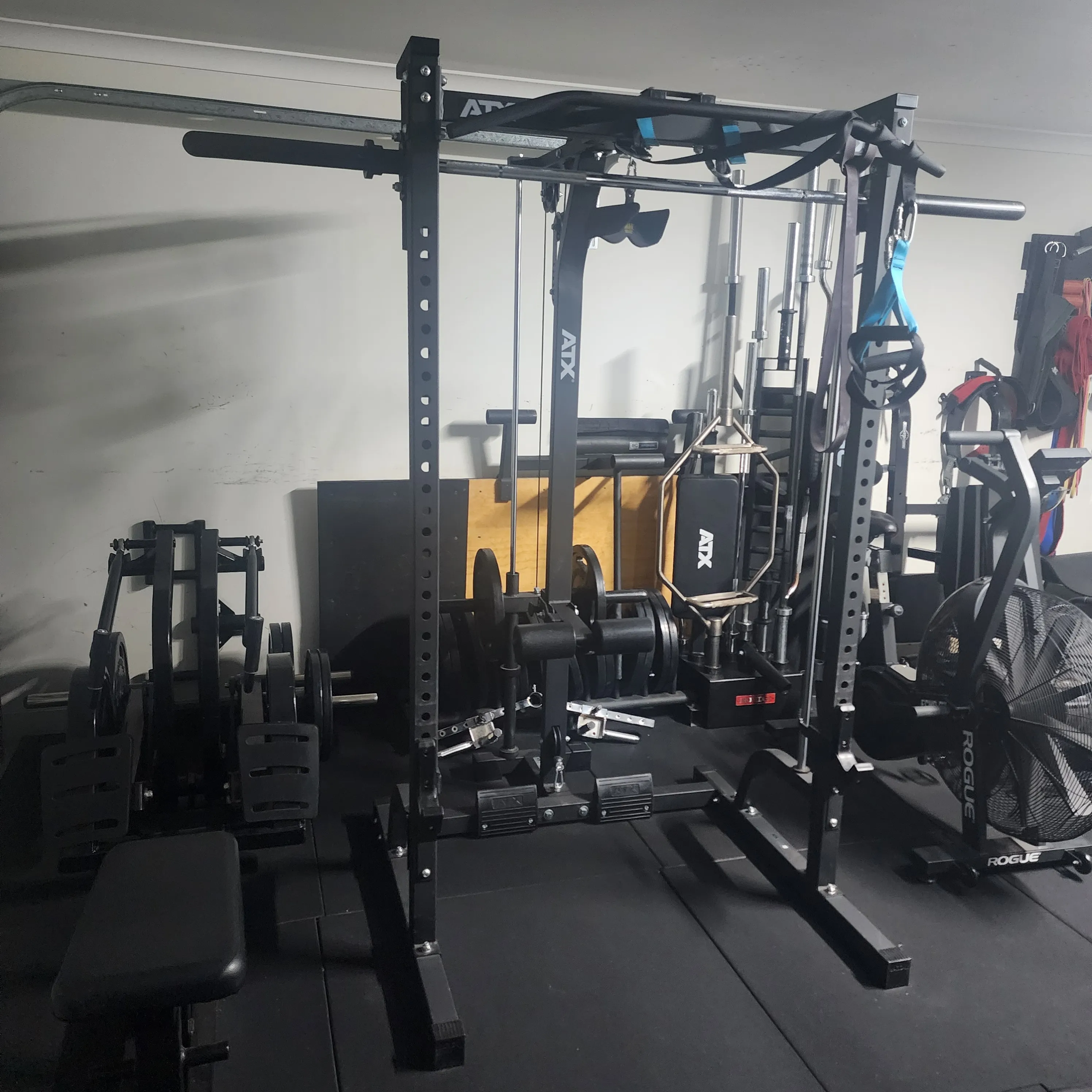 Personal training studio — power rack, cardio, and strength equipment